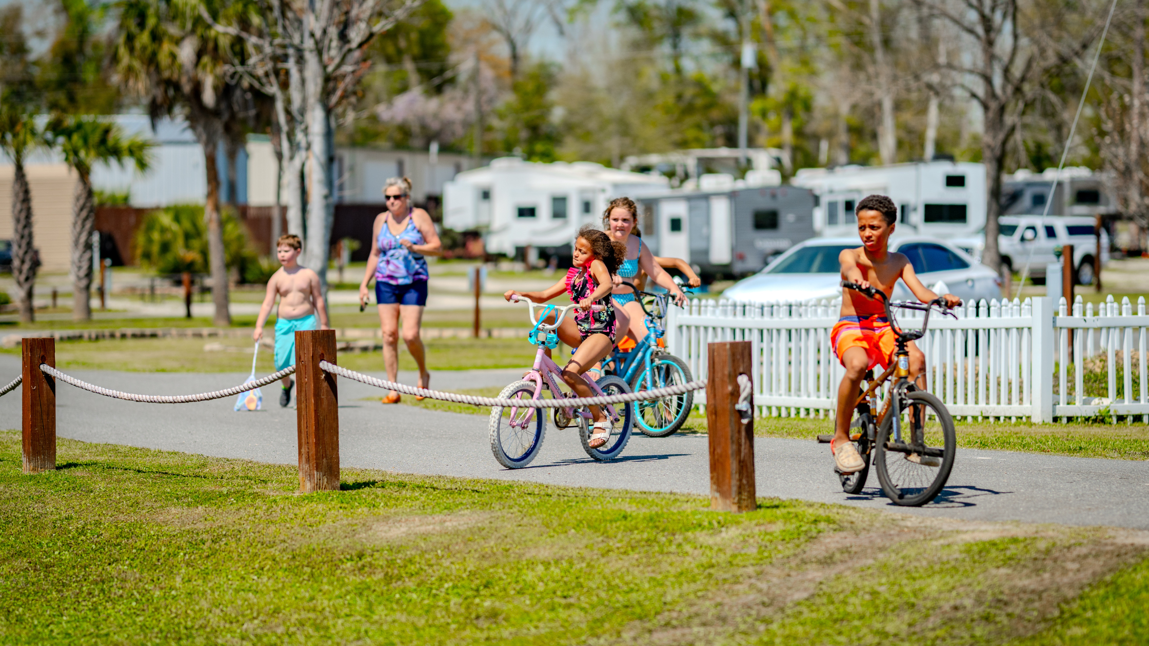 Photo of young kids riding on bikes